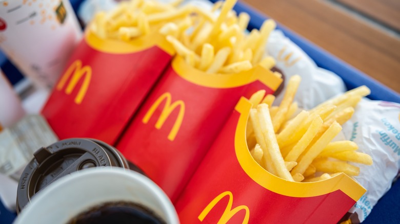 Three orders of McDonald's fries on a tray