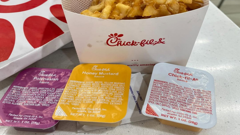 Chick-fil-A fries with an assortment of sauces, including Chick-fil-A sauce