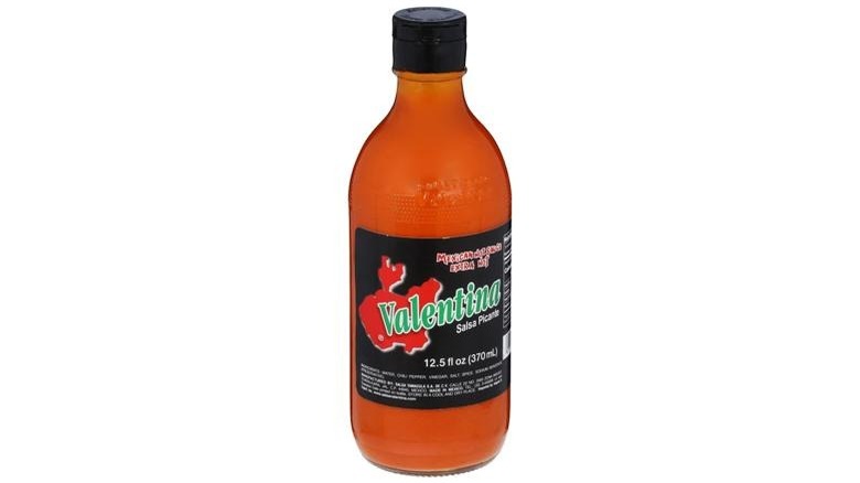A bottle of Salsa Valentina Black Label on a white background