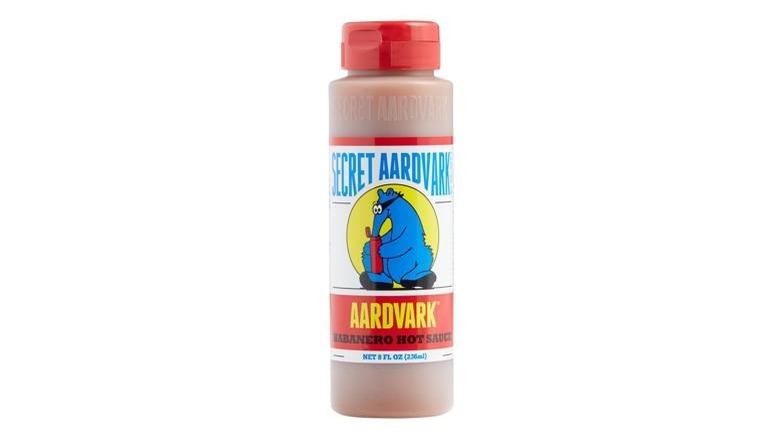 A bottle of Secret Aardvark hot sauce on a white background