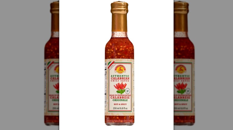 a bottle of TuttoCalabria Authentic Calabrian Chili Sauce on a white background