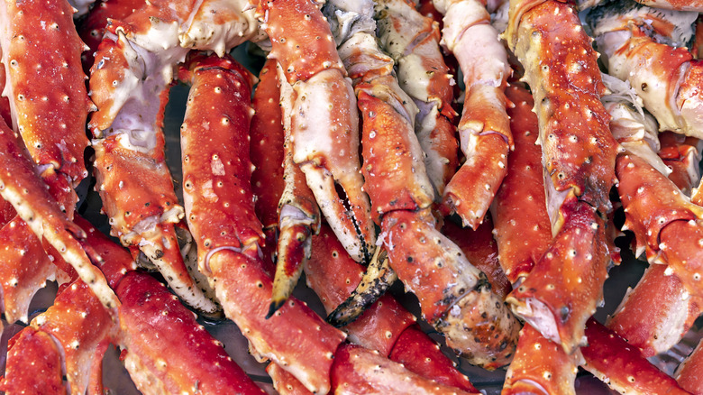 Piles of crab legs stacked on top of each other