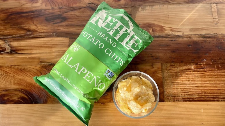 Over head view of a bag and dish of Kettle Brand Jalapeño Potato Chips