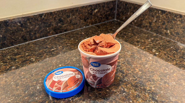 Pint of chocolate ice cream with a spoon