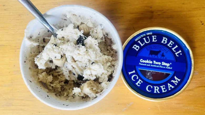 An opened pint of Blue Bell's Cookie Two-Step is photographed from overhead.