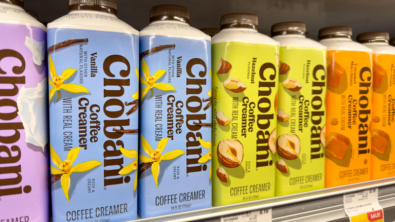 several flavors of chobani coffee creamer on a shelf