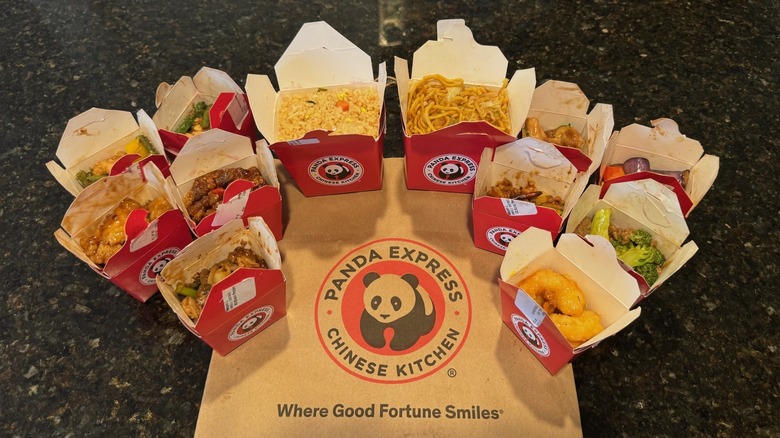 boxes of takeout food around Panda Express brown bag
