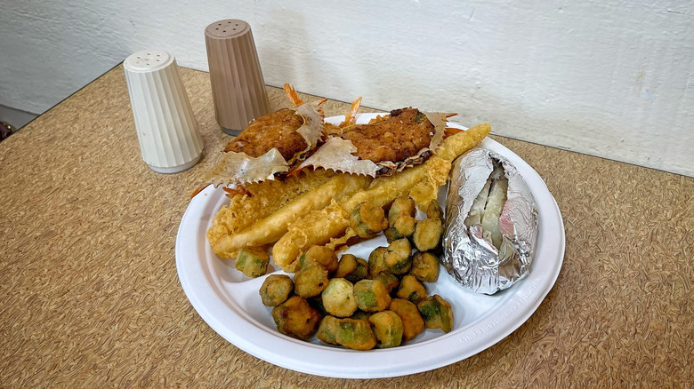 Captain D's Deluxe Seafood Platter with salt and pepper shakers on table