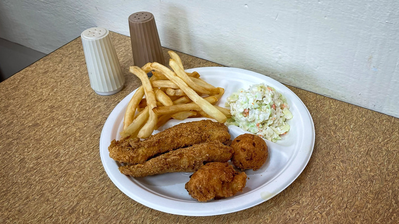 Captain D's Two Piece Catfish Meal with salt and pepper shakers on table