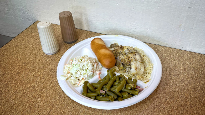 Captain D's Grilled Tilapia Meal with salt and pepper shakers on table