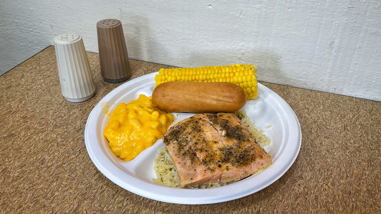 Captain D's Grilled Wild Alaska Salmon Meal with salt and pepper shakers on table