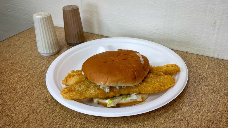 Captain D's Giant Fish Sandwich with salt and pepper shakers on table