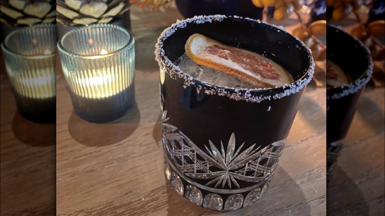 A glass of Cutwater Tequila Paloma with a salted rim and garnish