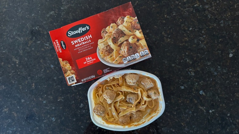 Package and tray of Stouffer's Swedish Meatballs on black countertop