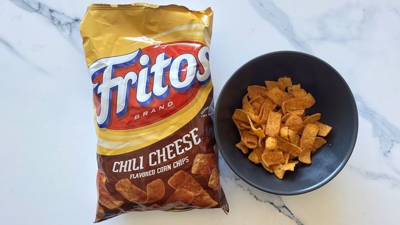 Chili cheese chips on marble background
