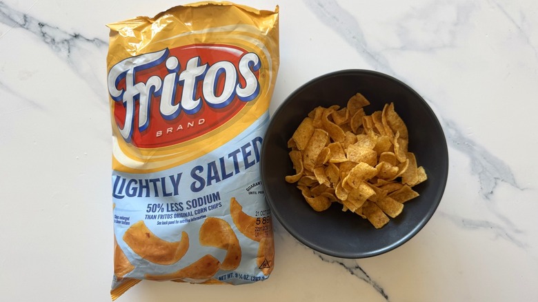 Lightly salted Fritos on marble surface