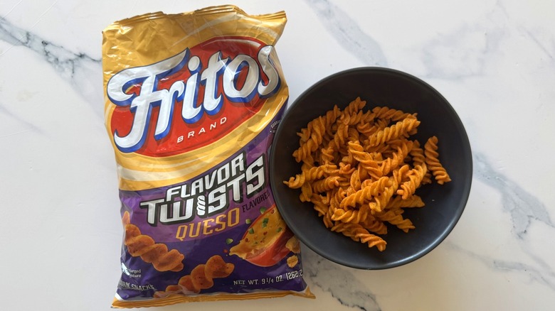 Queso Fritos Flavor Twists on marble background