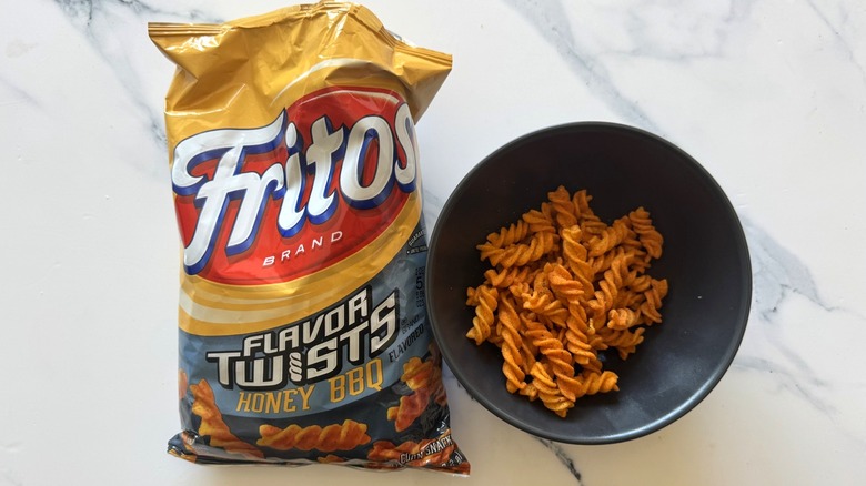 Honey barbecue Fritos Flavor Twists on marble background