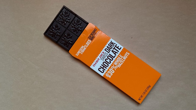 Trader Joe's Swiss Dark Chocolate with 30% Whole Hazelnuts on brown paper