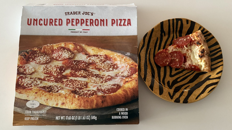 Trader Joe's viral frozen pizza with a slice on a plate