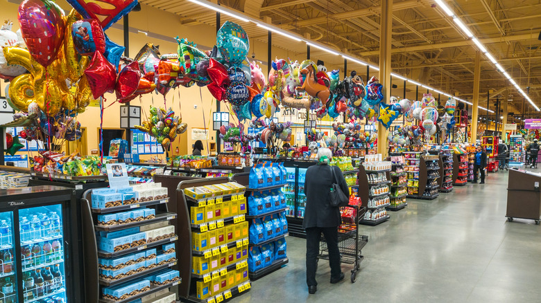 Wegmans supermarket checkout aisle.