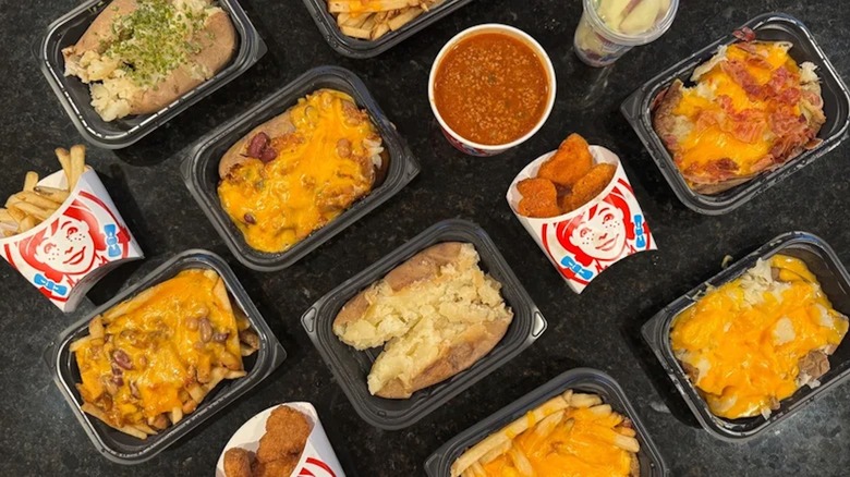 An assortment of sides from a Wendy's fast food restaurant spread out on a table
