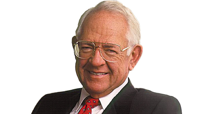 Dave Thomas wearing a suit