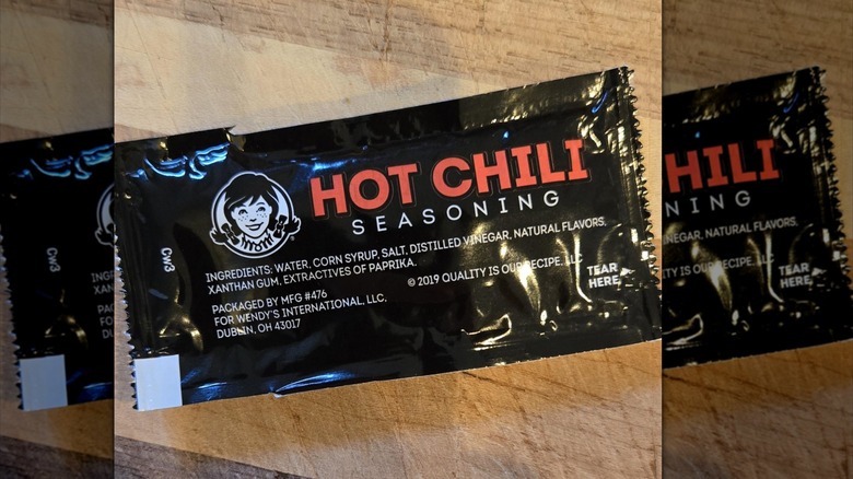 A packet of Wendy's Hot Chili Seasoning sauce.