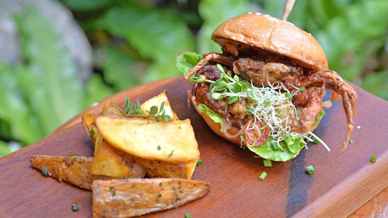 Soft shell crab burger with potato wedges.