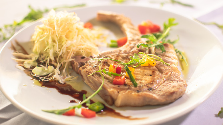 center cut pork chop with salad and dressing