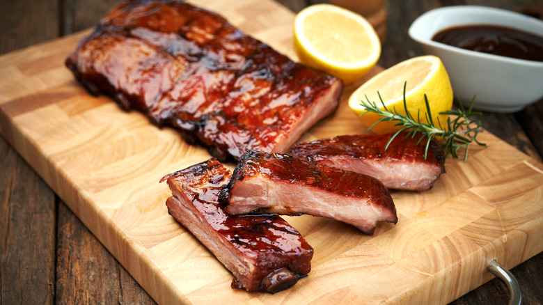 Pork ribs on wooden board