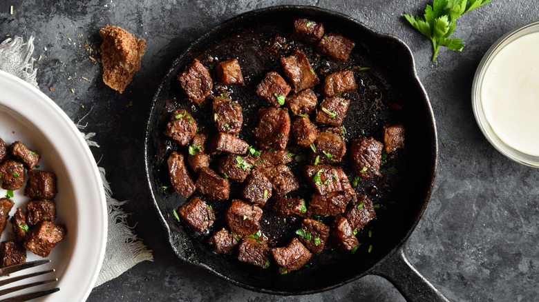 Steak bites in a cast-iron pan