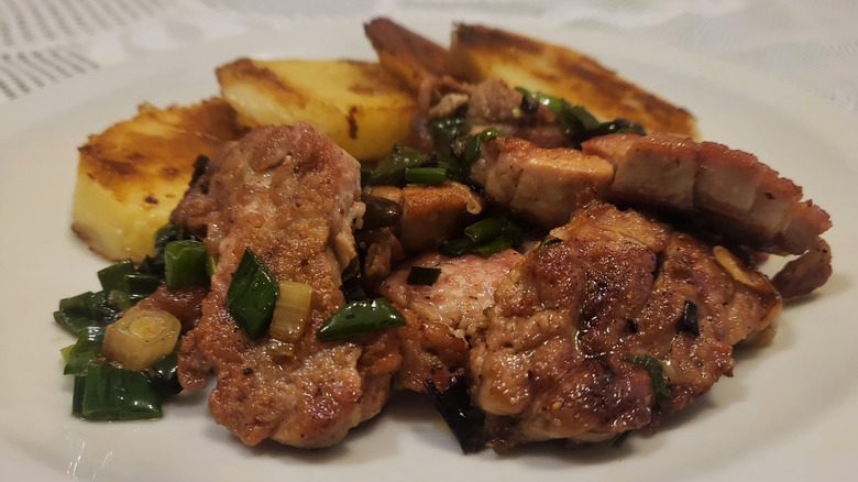 Plate of cooked sweetbreads with potatoes