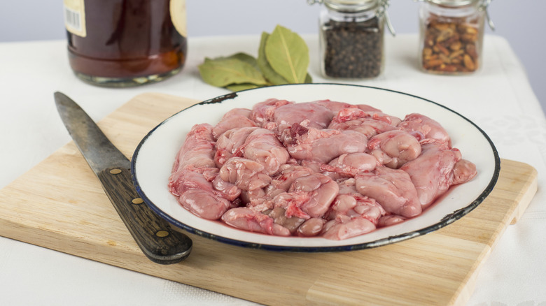 Plate of raw sweetbreads and seasonings