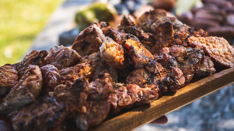 Grilled sweetbreads on wooden platter