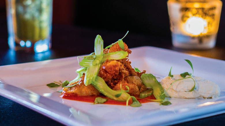 Plate of fried sweetbreads and greens