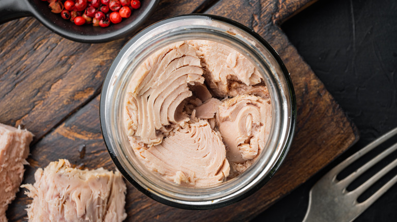 open can of tuna with fork