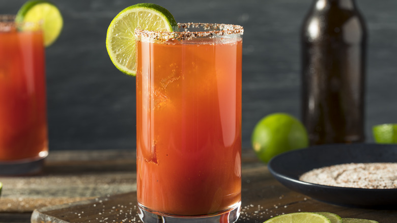 a michelada garnished with lime wheel.