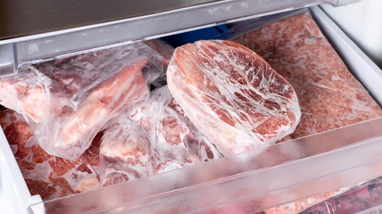 Frozen cuts of pork in a freezer