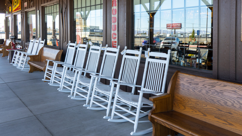 Chairs on Cracker Barrel porch next to a bench