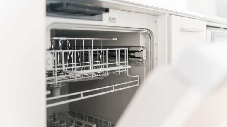 Close up photo of a dishwasher with the door open