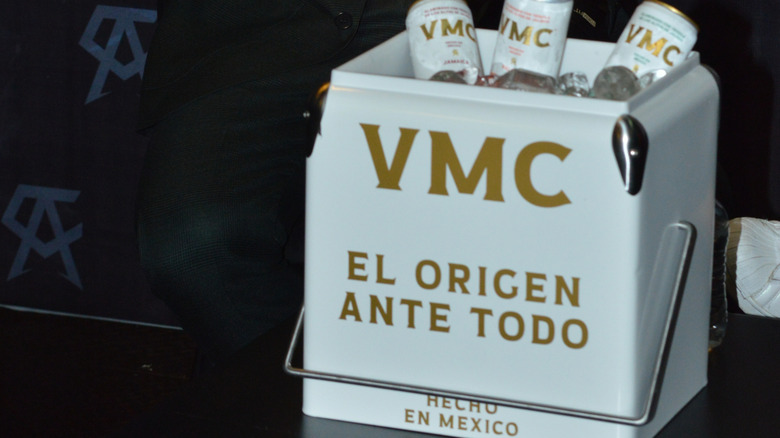 VMC canned drinks displayed in an open, branded cooler