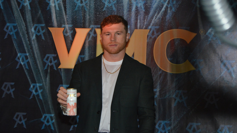 Saul Canelo Alvarez at the launch of VMC, holding a VMC can