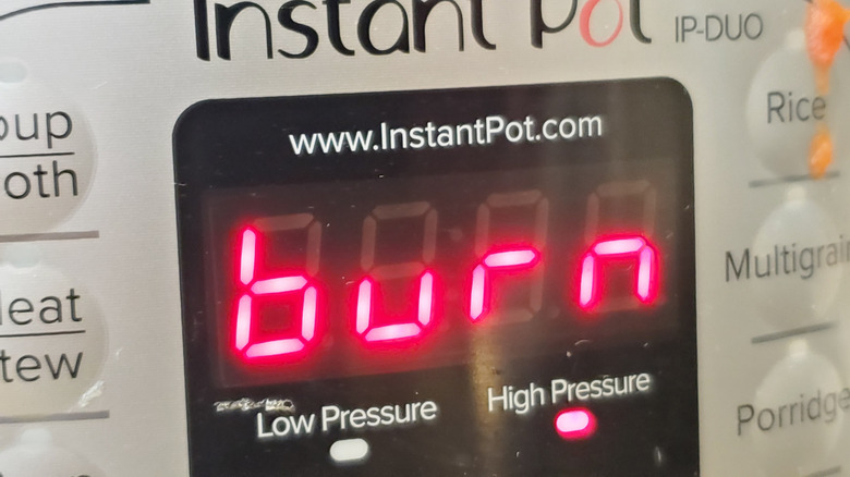 close up of instant pot with a burn notification
