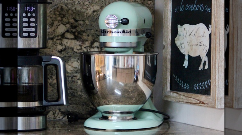 Mint green KitchenAid stand mixer on a kitchen counter