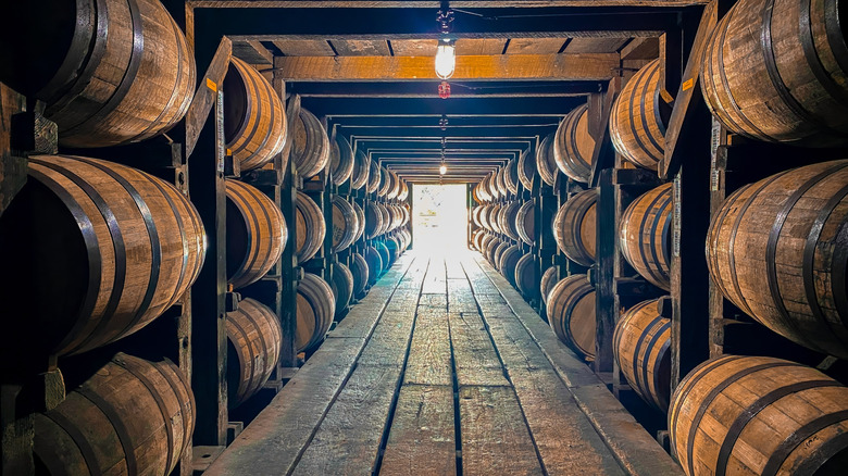 whiskey barrels in a rickhouse