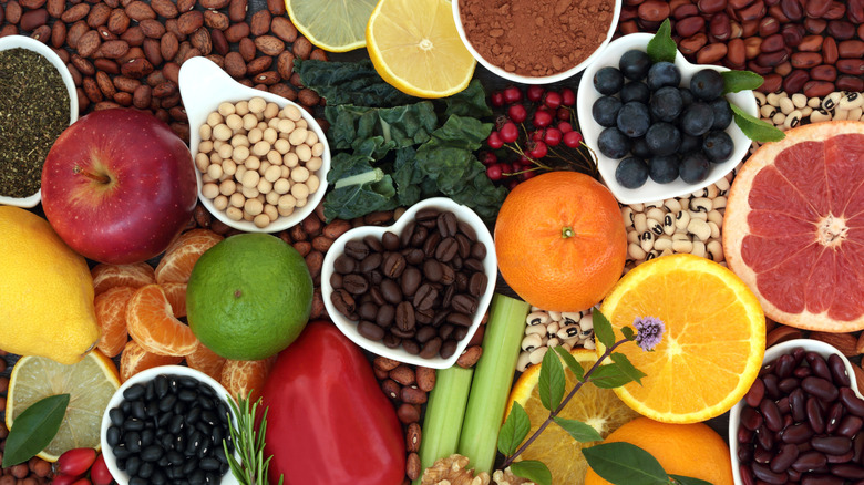 fruits veggies and nuts arranged together