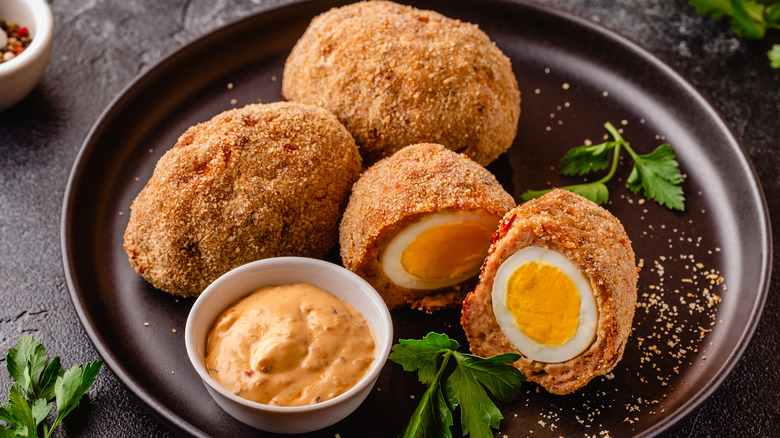 Scotch eggs on plate