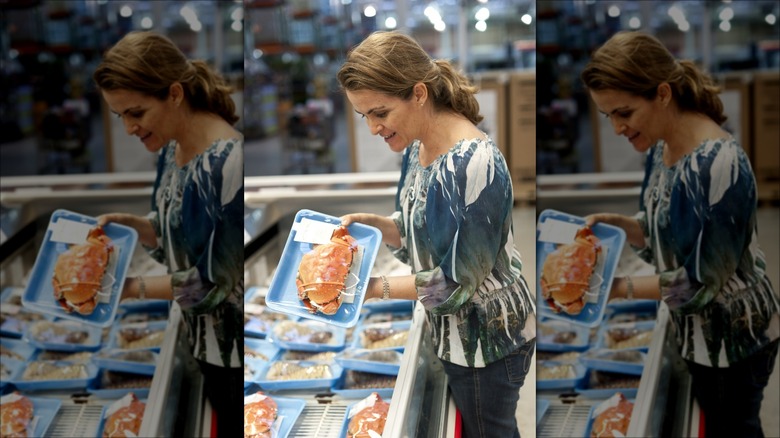Woman buying crab