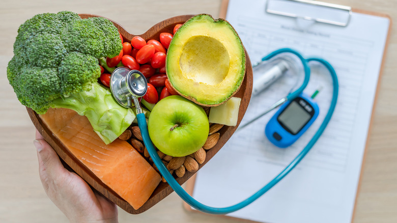 Fruits and vegetables in heart shape with stethoscope